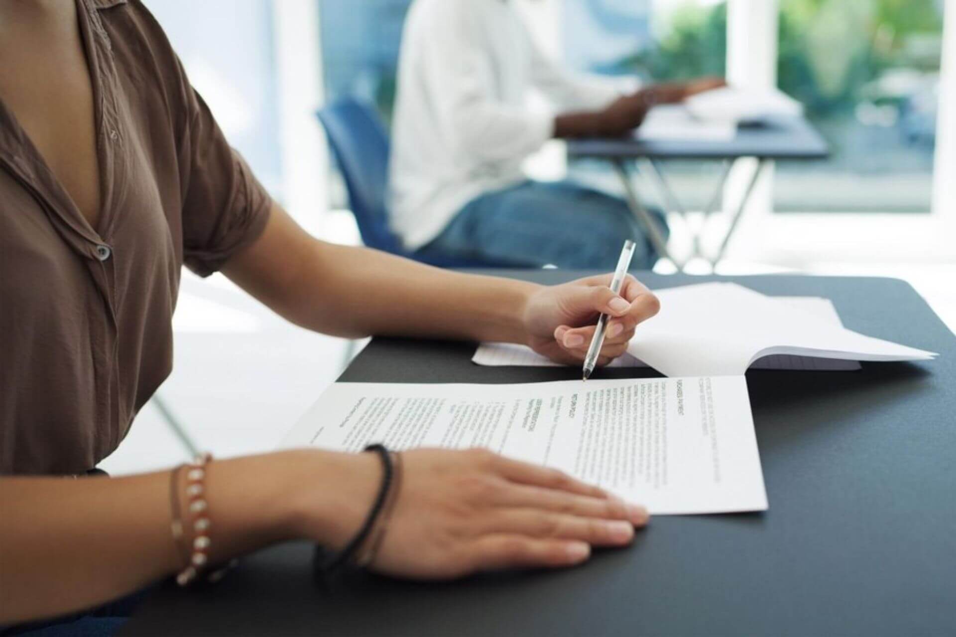 Teacher filling out a licensing application