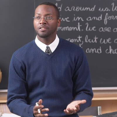 a man in a blue sweater